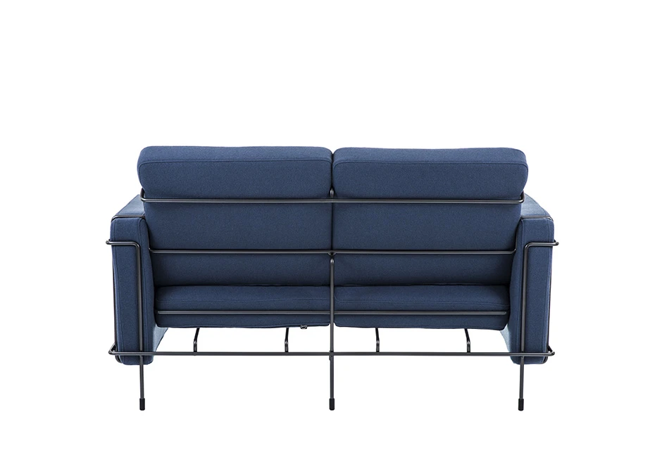 Sofá modular, com estrutura em aço e almofadas em espuma, em tecido azul, visto de costas em um fundo branco.