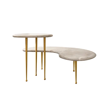 Mesas Mikonos com tampo de quartzo, granito ou mármore e pés de bronze fosco ou envelhecido. Por Simone Coste