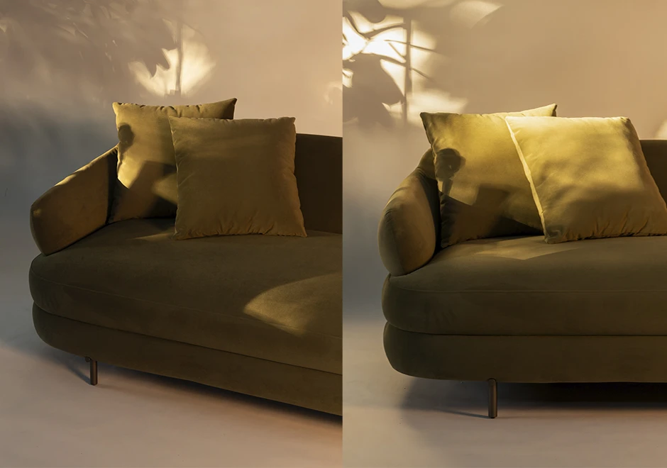 Close-up do sofá Gaudi em veludo verde, destacando suas almofadas macias e braços curvos, com iluminação suave que valoriza sua textura sofisticada.