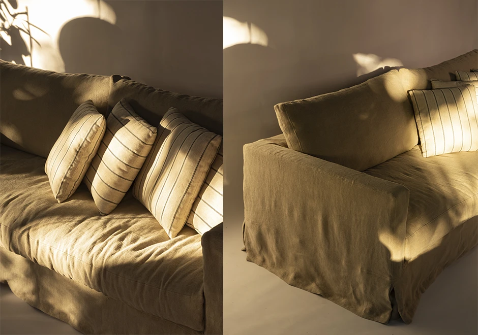 Detalhes do sofá Julia da Firma Casa, com almofadas em linho e acabamento despojado, valorizado pela luz natural.