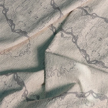 O tecido Amazônia da Fio, da Coleção Biomas, é uma homenagem à grandiosidade da floresta tropical brasileira. Nas cores beige e cinza.